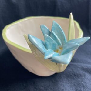 Closeup of hand sculpted blue anemone flower